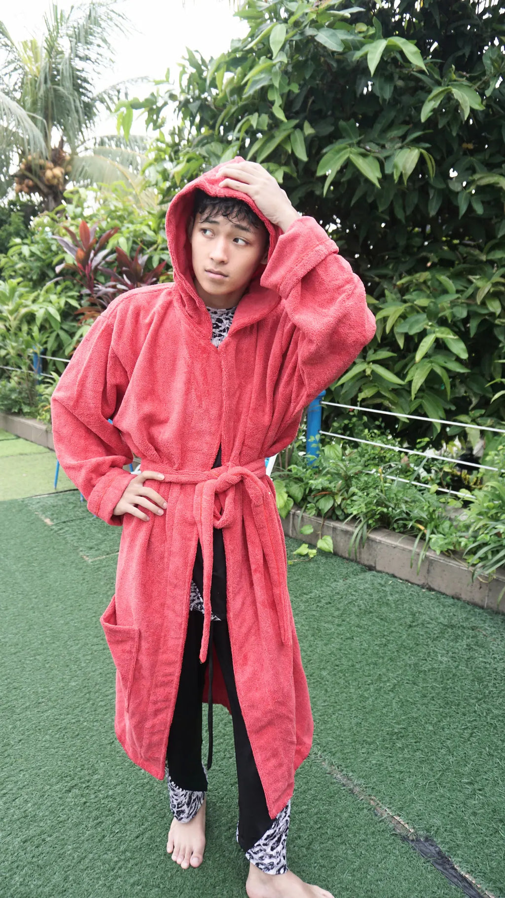 Close up details of Layyin microfiber hooded kimono towel worn by a model