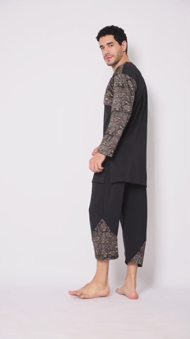 Close up details of black Layyin men’s swimwear with paisley pattern worn by a Muslim man